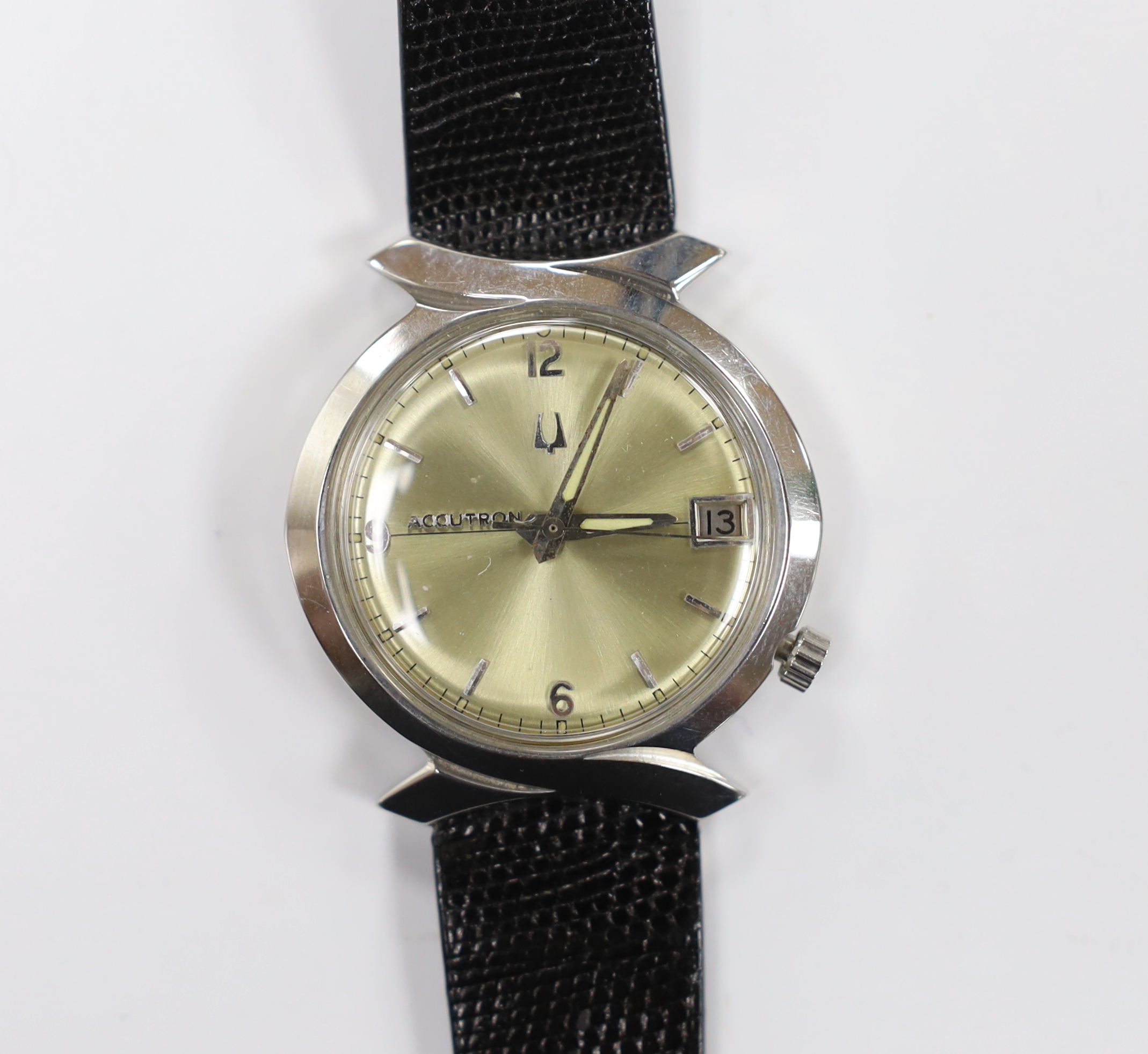 A gentleman's stainless steel Bulova Accutron wrist watch, with pale yellow dial, on Accutron strap, case diameter 36mm.
